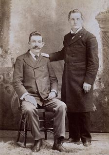 Reverend Eavens, a man with a hole in his chest, seated; with Reverend Kipe, standing, c1880s. Creator: WC Bell