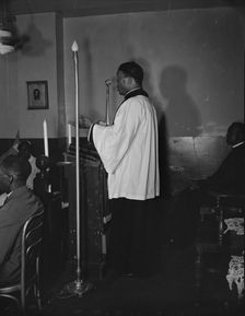 Reverend Vondell Gassaway, pastor of the St. Martin's Spiritual Church..., Washington, D.C., 1942. Creator: Gordon Parks