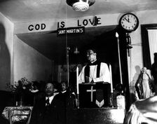 Reverend Vondell Gassaway, pastor of the St. Martin's Spiritual Church..., Washington, D.C., 1942. Creator: Gordon Parks