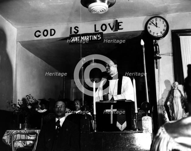 Reverend Vondell Gassaway, pastor of the St. Martin's Spiritual Church..., Washington, D.C., 1942. Creator: Gordon Parks.