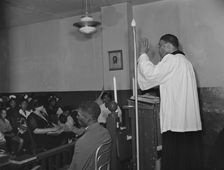 Reverend Vondell Gassaway, pastor of the St. Martin's Spiritual Church..., Washington, D.C., 1942. Creator: Gordon Parks