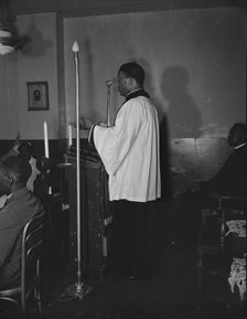 Reverend Vondell Gassaway, pastor of the St. Martin's Spiritual Church..., Washington, D.C., 1942. Creator: Gordon Parks