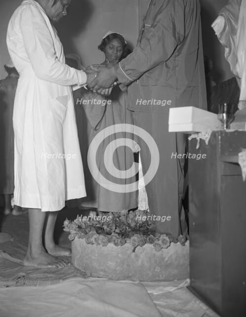 Reverend Vondell Gassaway, pastor of the St. Martin's Spiritual Church..., Washington, D.C., 1942. Creator: Gordon Parks.