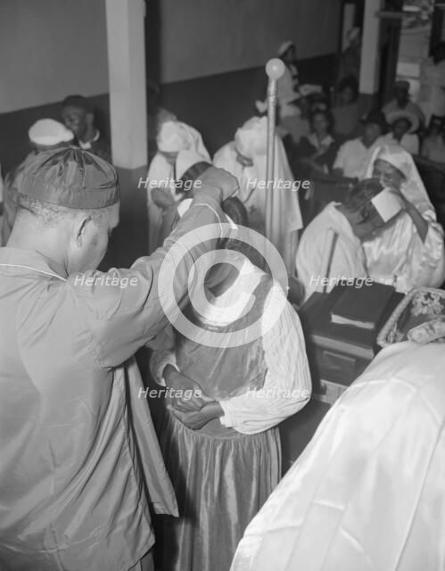 Reverend Vondell Gassway, pastor of the St. Martin's Spiritual Church..., Washington, D.C., 1942. Creator: Gordon Parks.