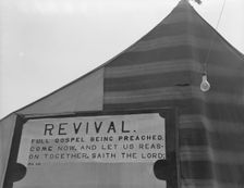 Revival meetings are held in Yakima shacktown, Sumac Park, Yakima, Washington , 1939. Creator: Dorothea Lange