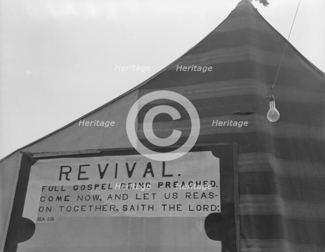 Revival meetings are held in Yakima shacktown, Sumac Park, Yakima, Washington , 1939. Creator: Dorothea Lange.