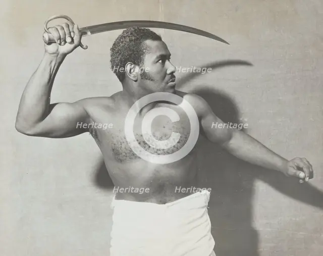 Rex Ingram, shirtless, with cutlass, 1938. Creator: Unknown.