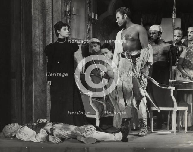 Rex Ingram, shirtless, with dead man, 1938. Creator: Unknown.