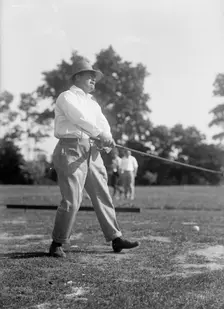 Reynolds, Ziba W. Pay Inspector of The Navy - Playing Golf, 1916. Creator: Harris & Ewing