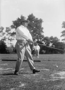 Reynolds, Ziba W. Pay Inspector of The Navy - Playing Golf, 1916. Creator: Harris & Ewing