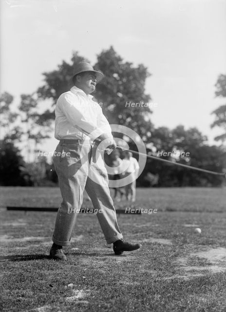 Reynolds, Ziba W. Pay Inspector of The Navy - Playing Golf, 1916. Creator: Harris & Ewing.