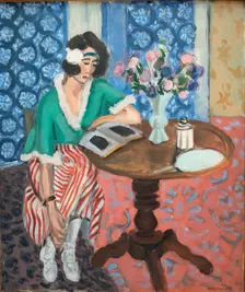 Reading woman at the table, 1921. Creator: Henri Matisse