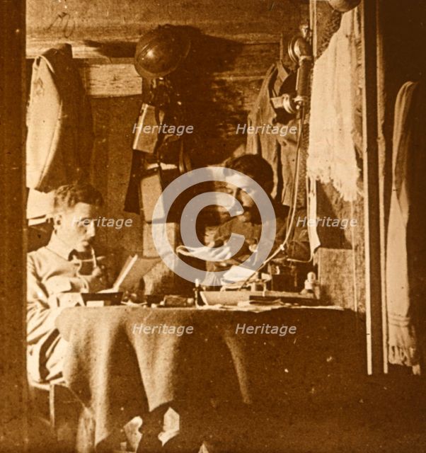 Reading in the trenches, c1914-c1918. Artist: Unknown.