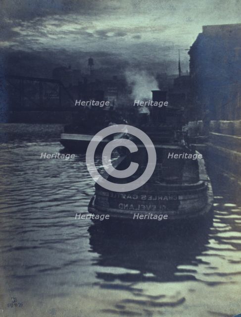 Rear view of tugboats approaching a wharf, possibly in Cleveland, Ohio, 1903. Creator: Unknown.