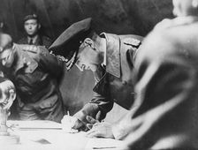 Rear-Admiral Gerhard Wagner signing the German surrender document ending World War II, 1945