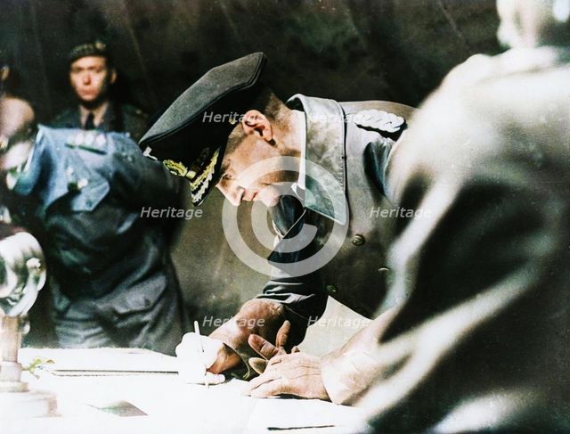 Rear-Admiral Gerhard Wagner signing the German surrender document ending World War II, 1945. Creator: Unknown.