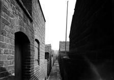 Rear alley of Hammond Street, Tunstall, the Potteries, Staffordshire, 1960. Artist: Herbert Felton