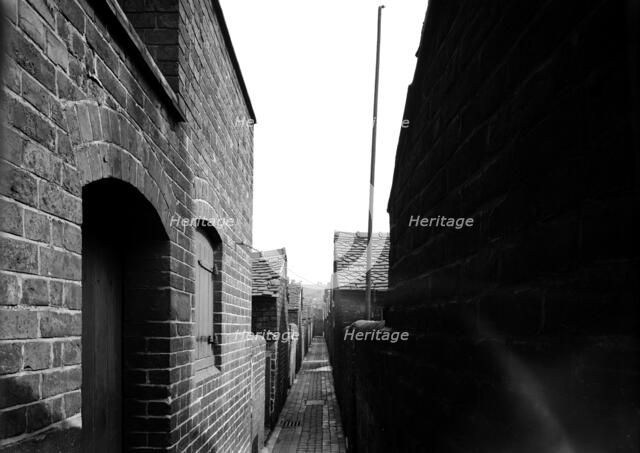 Rear alley of Hammond Street, Tunstall, the Potteries, Staffordshire, 1960. Artist: Herbert Felton