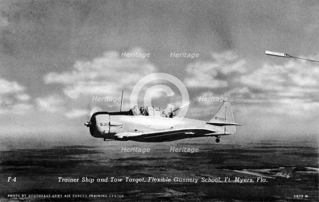 Rear gunner shooting at a tow target, Flexible Gunnery School, Fort Myers, Florida, USA, 1943. Artist: Southeast Army Air Forces Training Center