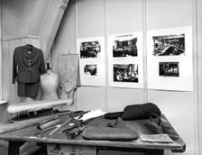 Reconstruction of a tailor's workshop in London's East End. Creator: Sidney Harris