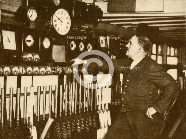 'Recording Daily Time Signal at Liverpool Street Station, London and North Eastern Railway', 1930. Creator: Topical Press Agency.