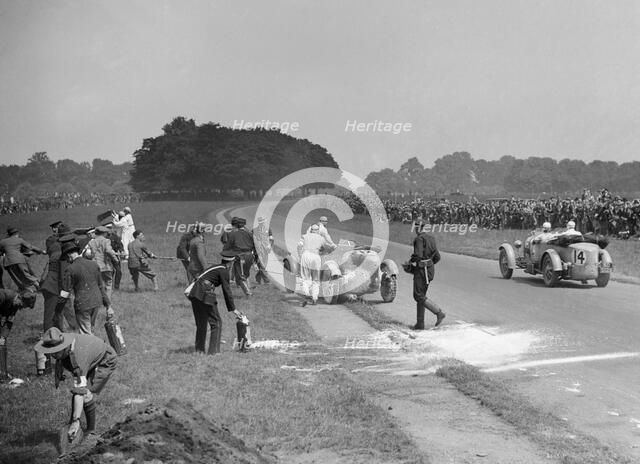 Recovering George Eyston's fire-damaged Bugatti T43, Irish Grand Prix, Phoenix Park Dublin, 1929. Artist: Bill Brunell.