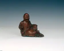 Reclining boxwood luohan figure, Qing dynasty, China, 18th century. Creator: Unknown