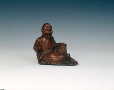 Reclining boxwood luohan figure, Qing dynasty, China, 18th century. Creator: Unknown