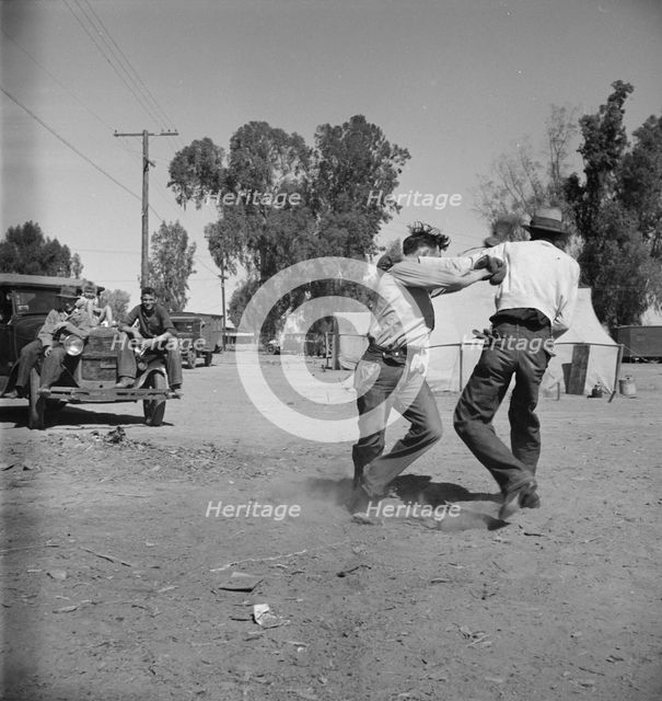 Recreation in a migratory agricultural workers' camp near Holtville, California, 1937. Creator: Dorothea Lange.