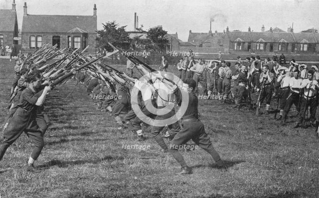 'Recruits learning the use of the bayonet', 1915. Artist: Unknown.