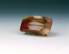 Red agate dagger scabbard slide, Western Han dynasty, China, 206 BC-8. Creator: Unknown