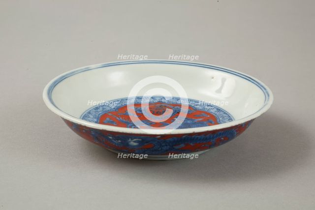 Red clobbered blue and white saucer with stork, phoenix and dragons, Jiajing (1522-1566). Creator: Unknown.