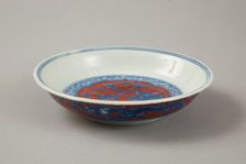 Red clobbered blue and white saucer with stork, phoenix and dragons, Jiajing (1522-1566). Creator: Unknown