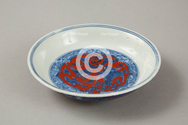 Red clobbered blue and white saucer with stork, phoenix and dragons, Jiajing (1522-1566). Creator: Unknown.