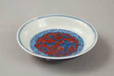 Red clobbered blue and white saucer with stork, phoenix and dragons, Jiajing (1522-1566). Creator: Unknown