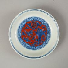 Red clobbered blue and white saucer with stork, phoenix and dragons, Jiajing (1522-1566). Creator: Unknown