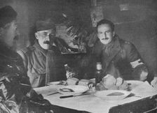 Red Cross officers at dinner in a dug-out 1914