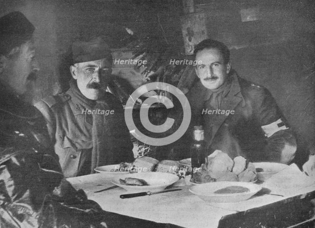 'Red Cross officers at dinner in a dug-out', 1914. Artist: Unknown.