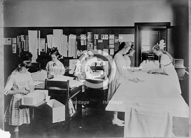 Red Cross Garment Division, Misc. Views of Work Rooms And Women Sewing, Knitting, Etc., 1917. Creator: Harris & Ewing.