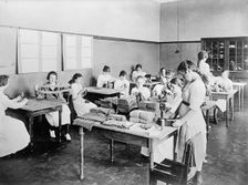 Red Cross Garment Division, Misc. Views of Work Rooms And Women Sewing, Knitting, Etc., 1917. Creator: Harris & Ewing