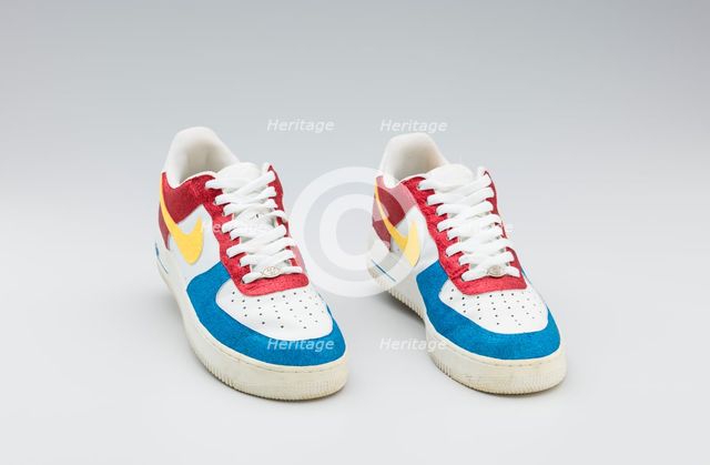 Red, white, yellow, and blue Nike sneakers worn by Big Boi of Outkast, 2005-2006. Creator: Nike.