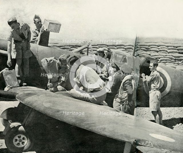 Refuelling and re-arming Spitfire fighters, Malta, World War II, 1942 (1944). Creator: Unknown.