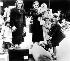 Refugees with their belongings, German-occupied Paris, July 1940