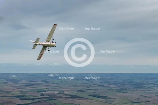 Reims-Cessna F172M Skyhawk in flight near Driffield, East Riding of Yorkshire, 2023. Creator: Chloe Pearson Jones.