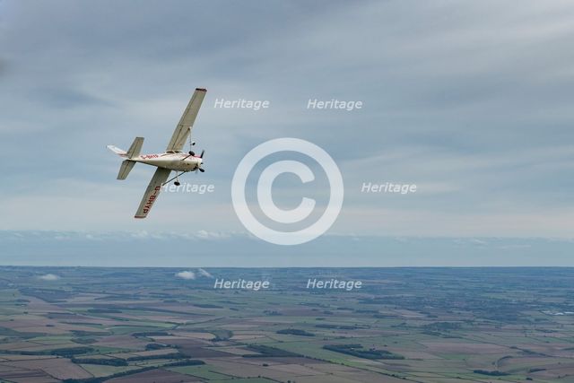 Reims-Cessna F172M Skyhawk in flight near Driffield, East Riding of Yorkshire, 2023. Creator: Chloe Pearson Jones.