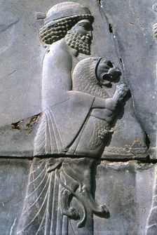 Relief of a man holding a lion cub, Persepolis, Iran