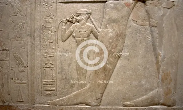 Relief of legs of Mereruka with his wife Watetkhethor..., Mastaba of Mereruka, Egypt, 2003.   Creator: Unknown.