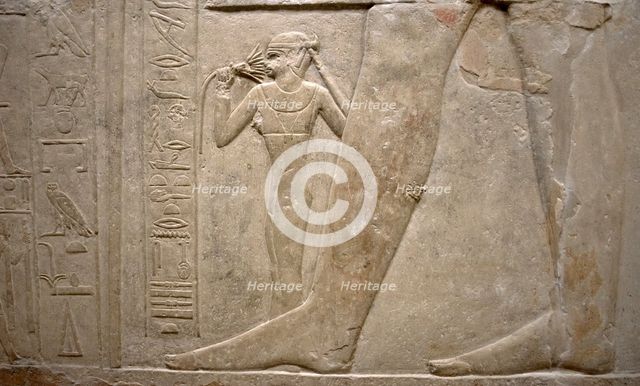 Relief of legs of Mereruka with his wife Watetkhethor..., Mastaba of Mereruka, Egypt, 2003.   Creator: Unknown.