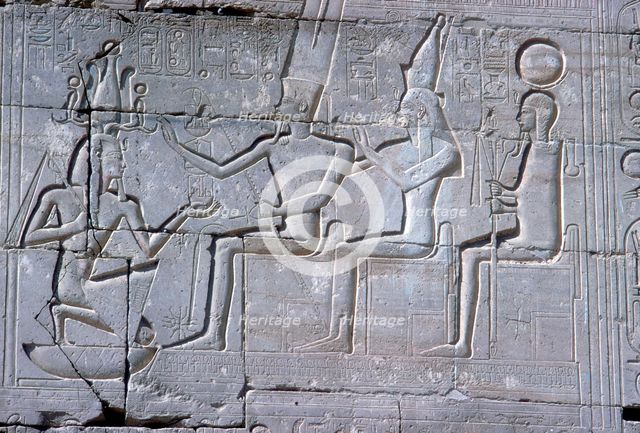Relief of Rameses II kneeling before Amun Mut & Khons, The Ramesseum, Luxor, Egypt, c1250 BC. Artist: Unknown