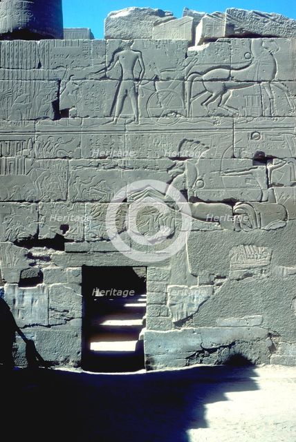 Relief of the Pharoah in chariot riding down his enemies, Temple of Amun, Karnak, c14th century BC. Artist: Unknown
